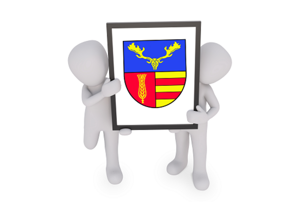 zwei 3D Figuren mit dem Wappen der Gemeinde Lensahn